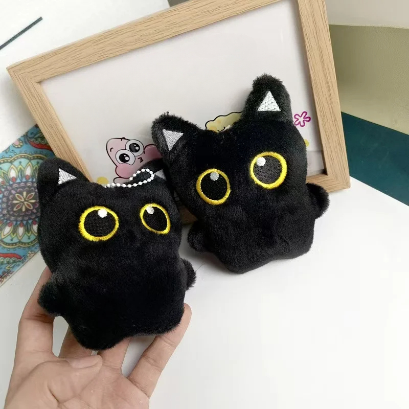 Cute plush toy of a black cat, - Photography Rules reseña y precio