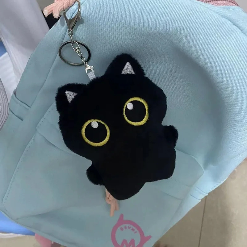 Cute plush toy of a black cat, - Photography Rules reseña y precio